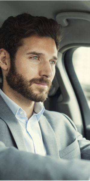 Man in a car driving 